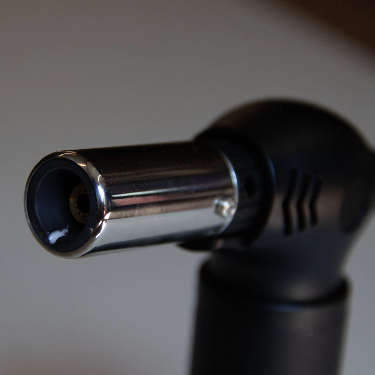 Close-up of the Forest Grill torch nozzle for quickly lighting charcoal