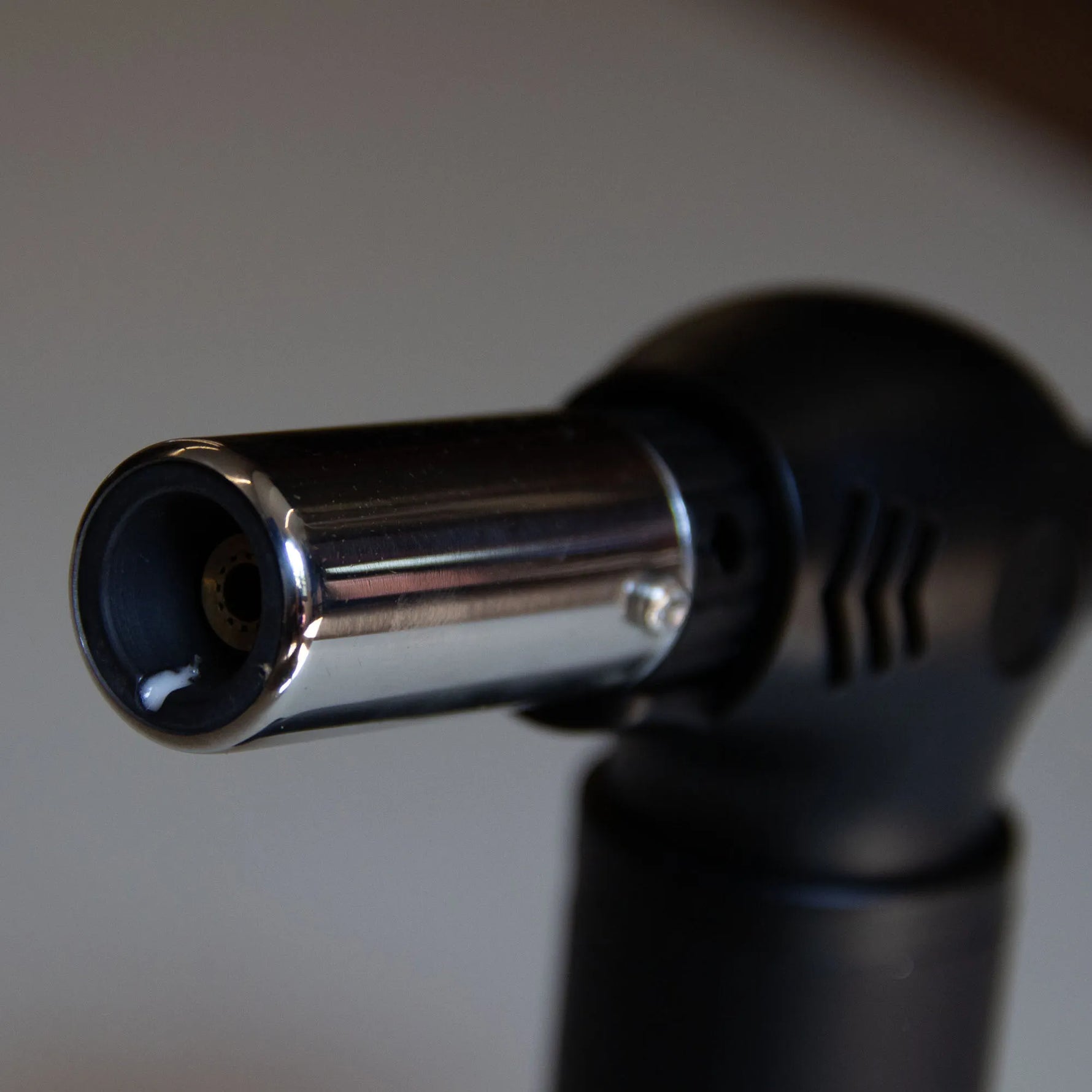 Close-up of the Forest Grill torch nozzle for quickly lighting charcoal