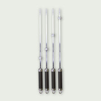 Set of four stainless steel skewers with black handle and adjustable locking ring to hold the food.