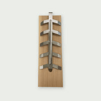 Wooden smoking board with adjustable stainless steel support, ideal for holding a salmon fillet during vertical cooking on the kamado.