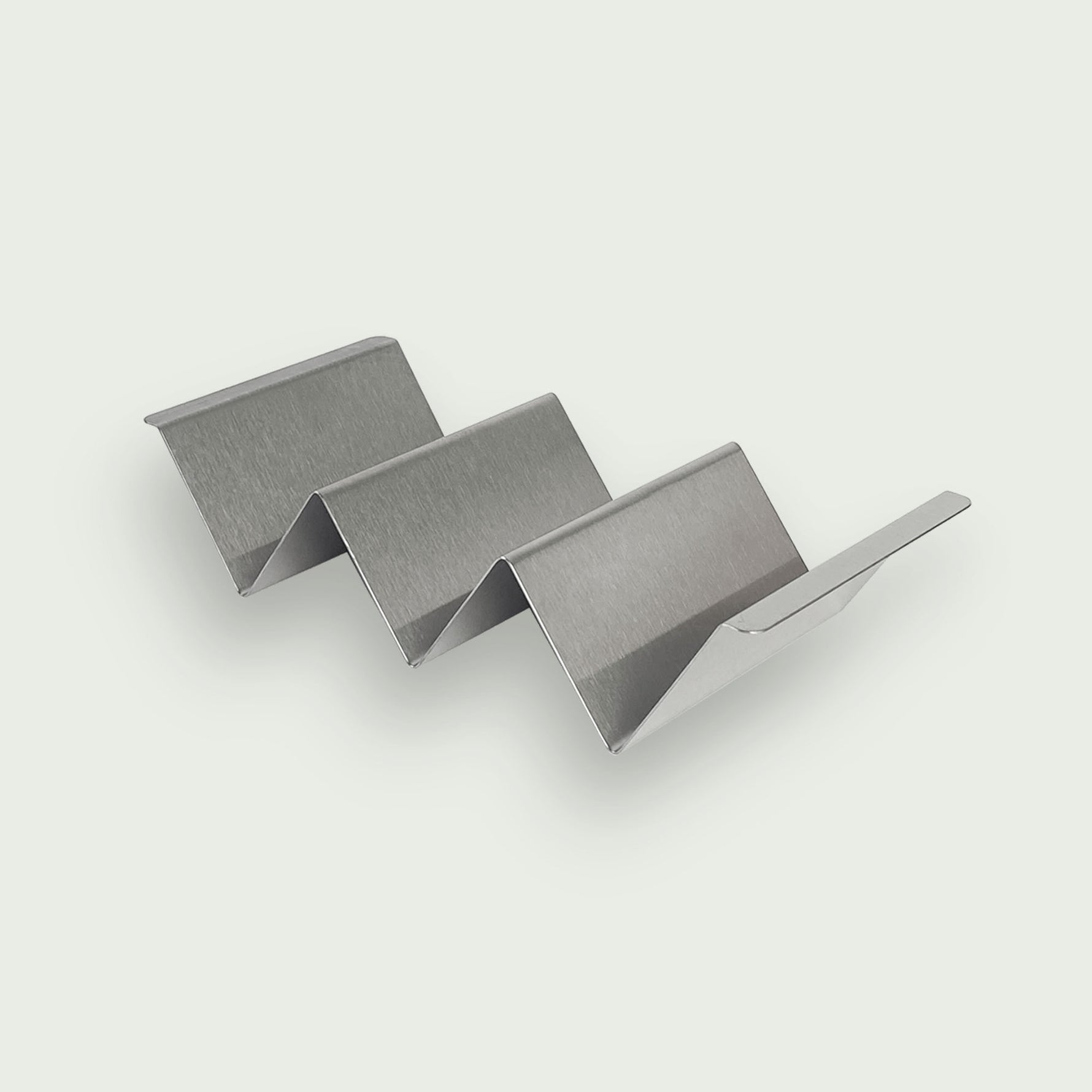 Support à tacos en inox brossé, idéal pour maintenir et garnir facilement plusieurs tacos sans les renverser lors de la préparation ou du service.